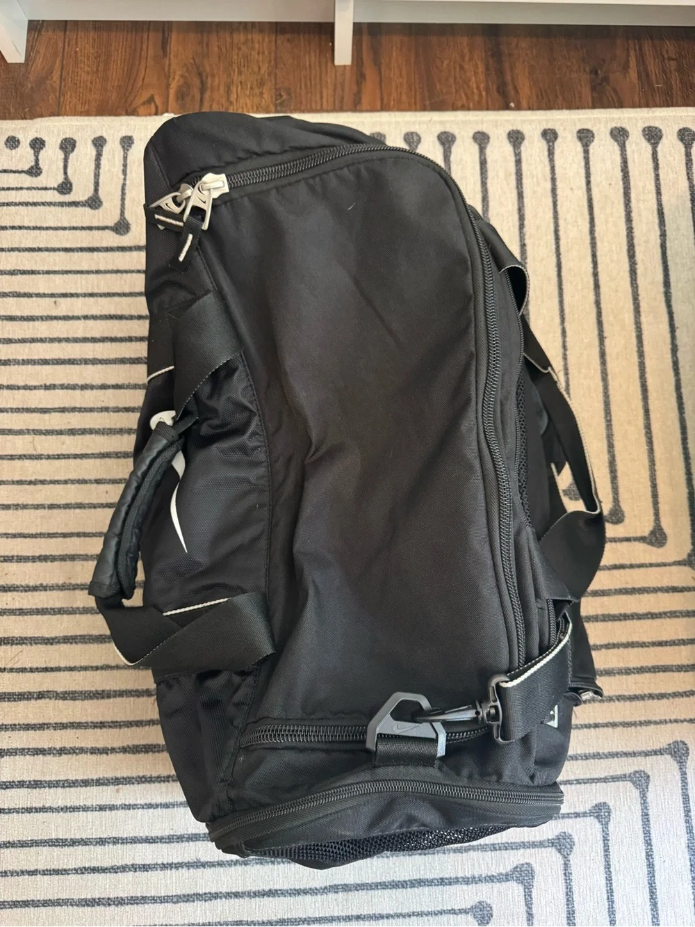 Nike Black Duffel Bag with White Swoosh Accent